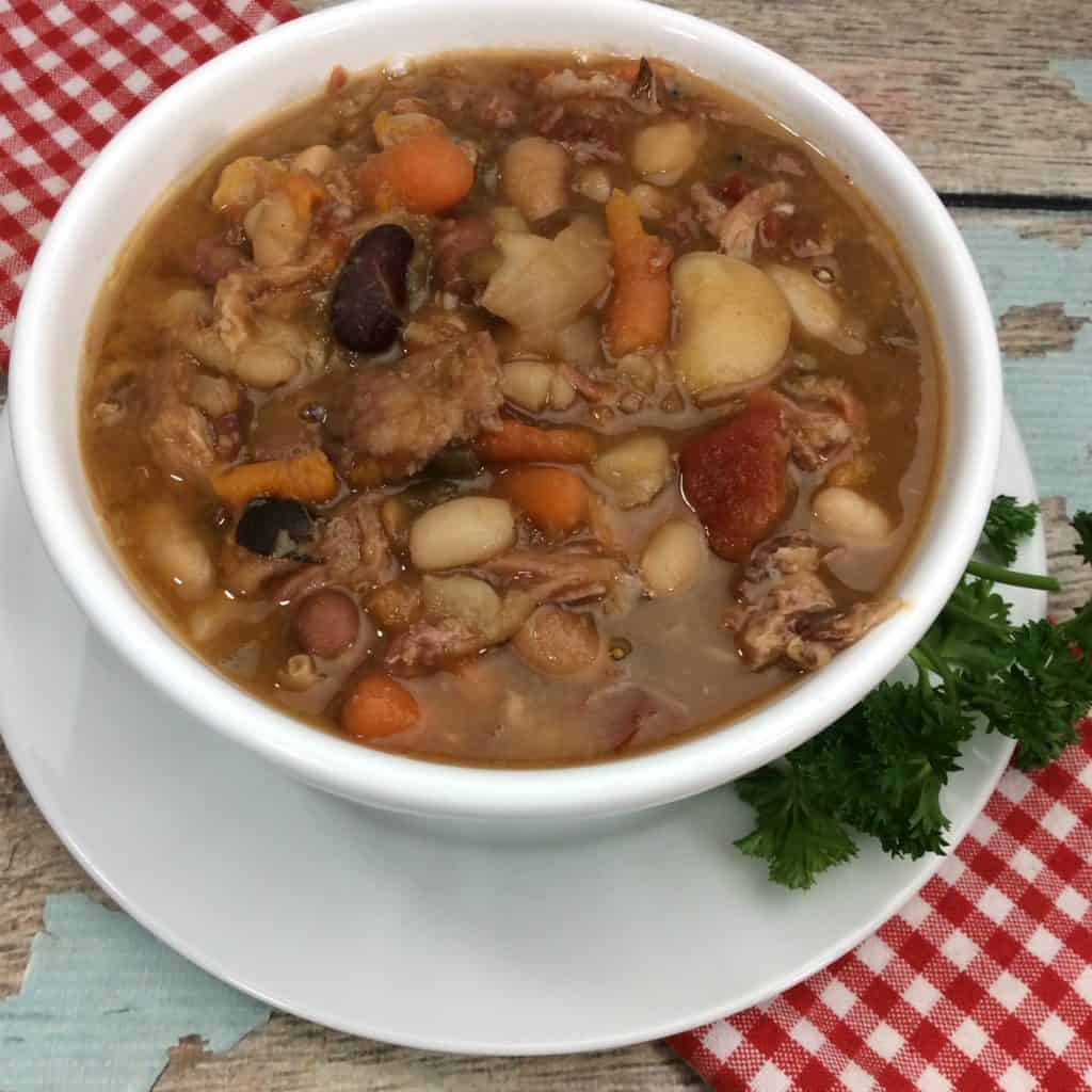 Looking for a delicious, hearty soup to keep you warm this winter? Look no further than this Ham Bone Vegetable Soup Slow Cooker Recipe! This soup is perfect for a cold day. 