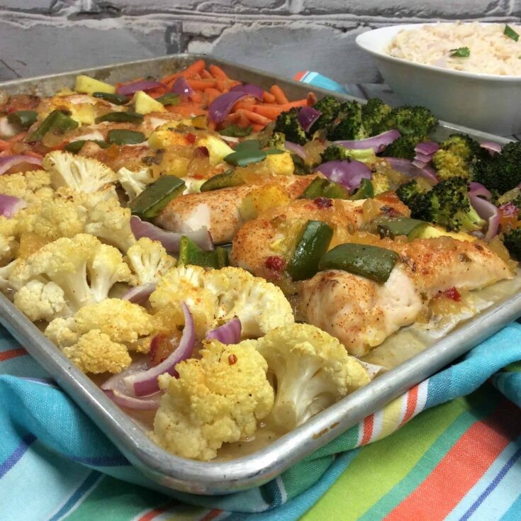 Looking for an easy, flavorful chicken dinner? This Sheet Pan Pineapple Spiced Chicken is perfect! Just toss the ingredients together on one pan and bake.