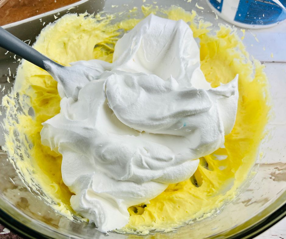 Adding Cool Whip to the pudding mix