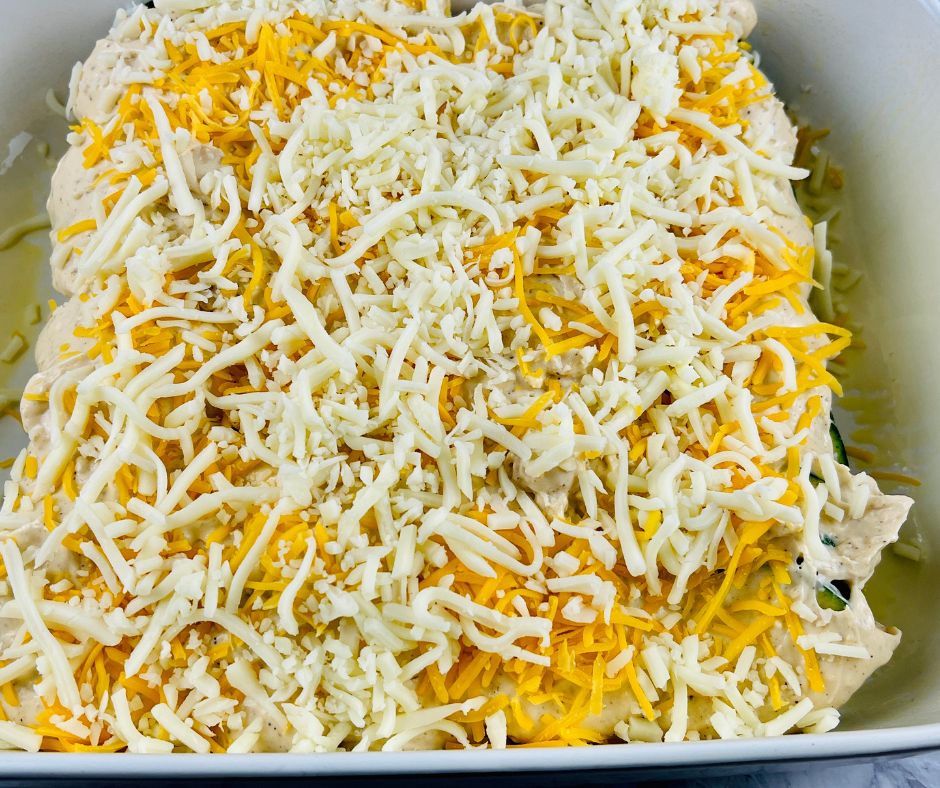 sprinkle zucchini with shredded cheeses