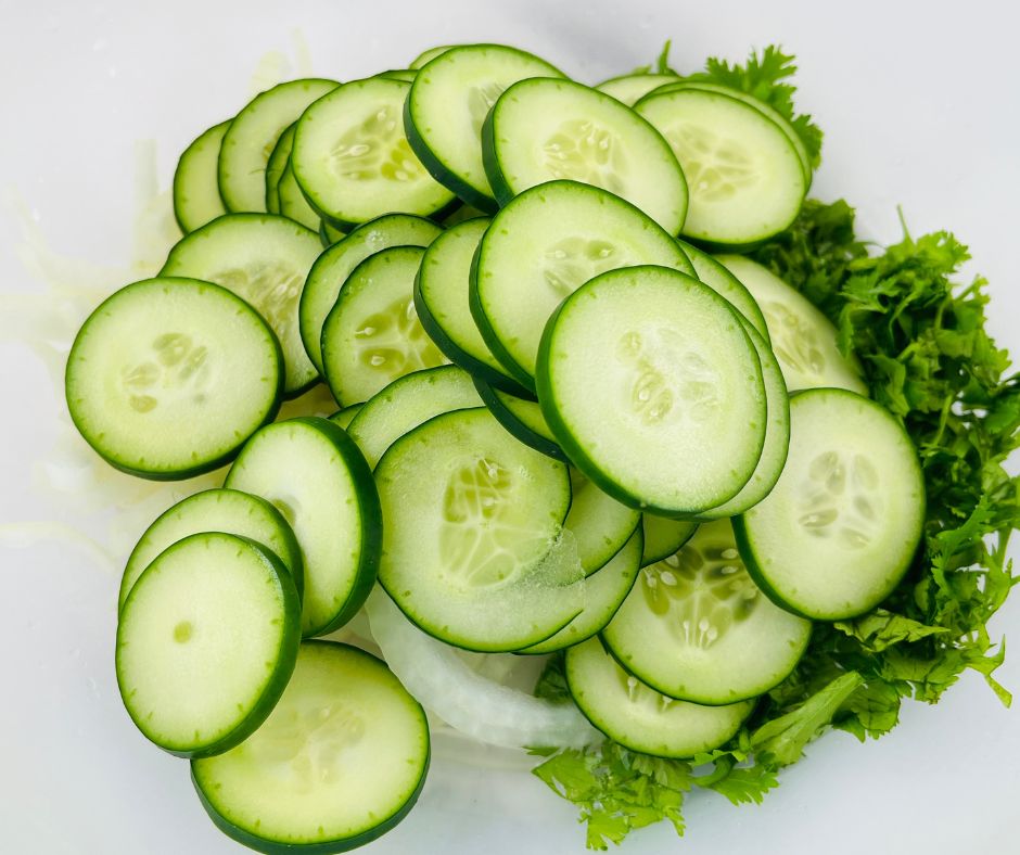slice cucumbers and onions