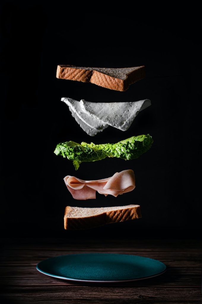 simple sandwich ingredients artistically floating on air